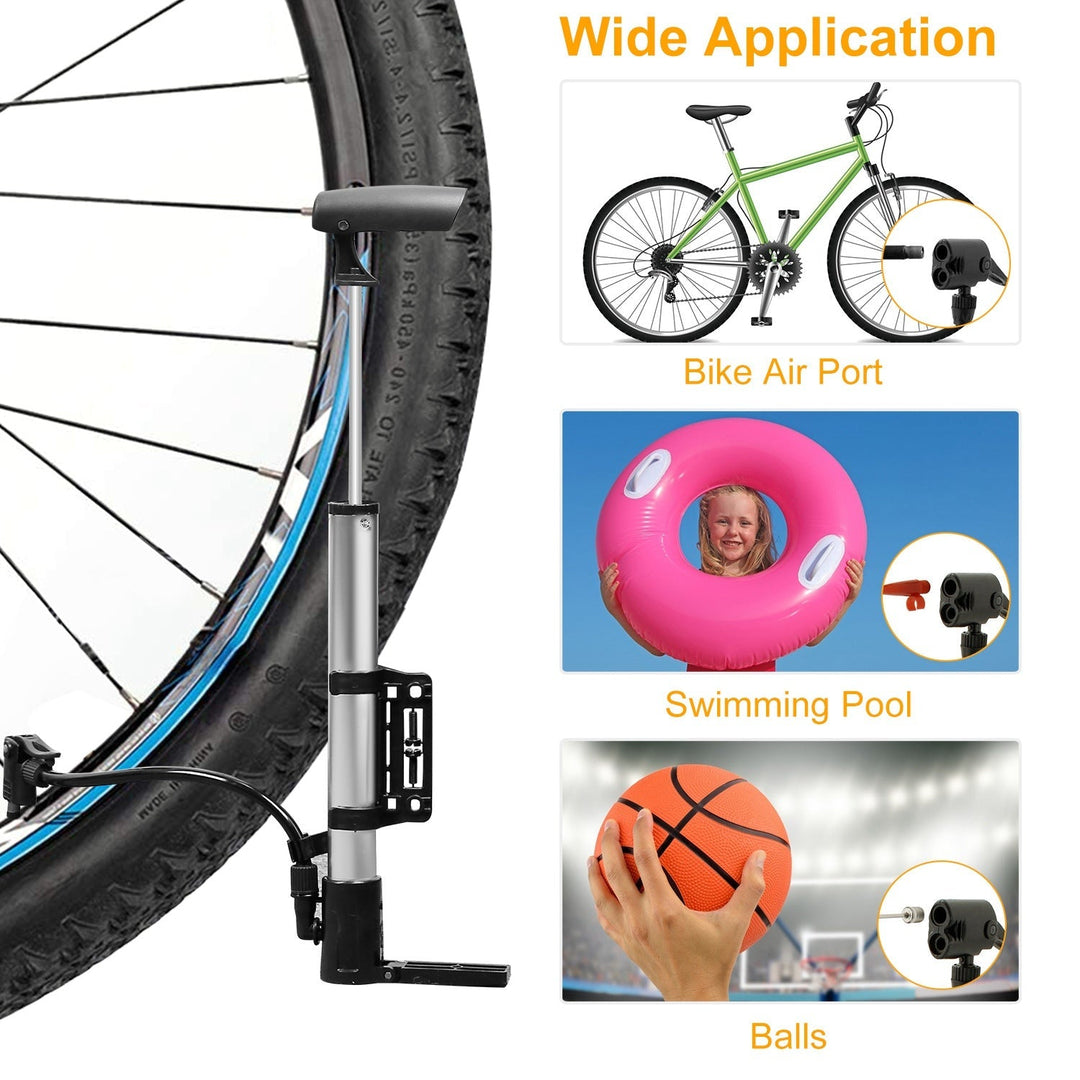 Mini bike tire inflator pump connected to a bike wheel, with hose and nozzle