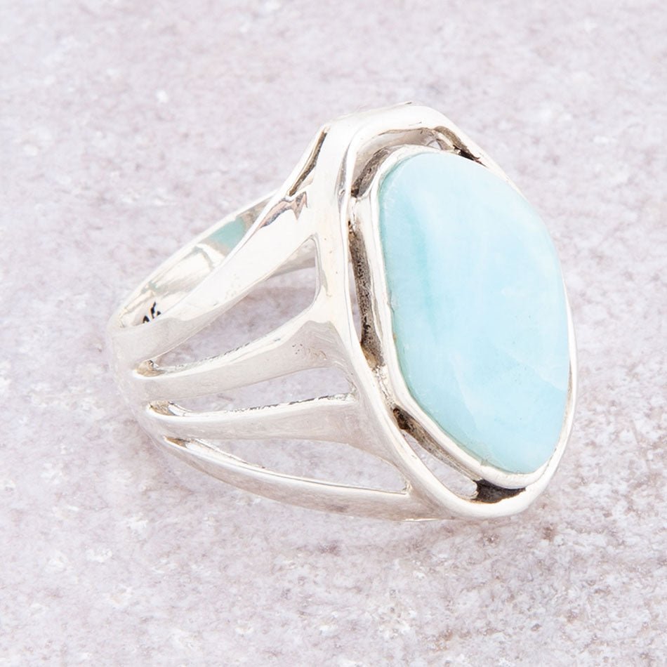 Sterling silver statement ring with oval blue larimar cabochon and openwork sides