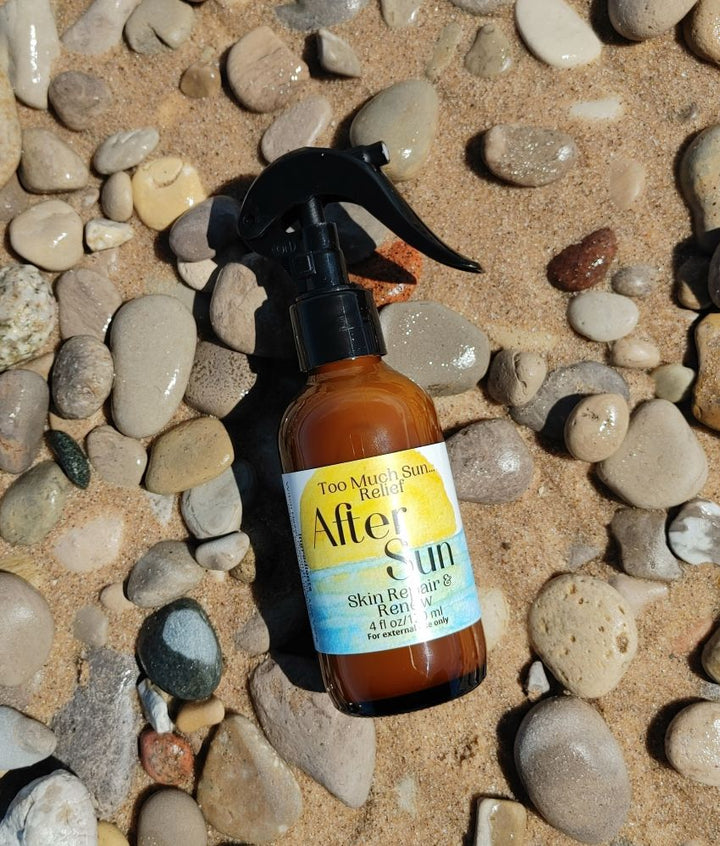 After sun skin relief spray bottle with black pump, amber liquid close-up.