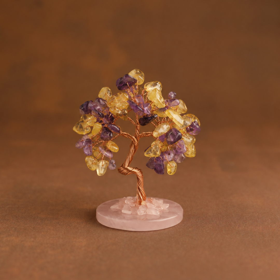 Crystal tree ornament with purple and yellow gemstone chips on pink round base