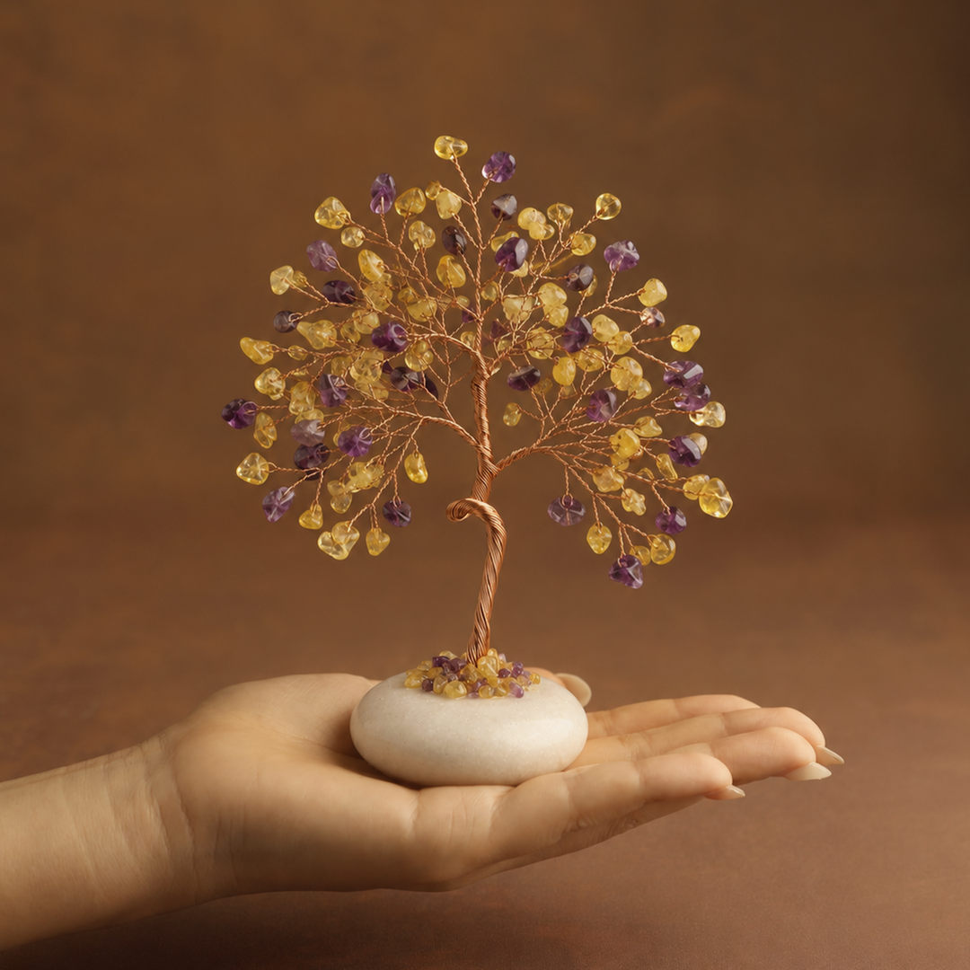 Colorful crystal tree ornament with purple and yellow gem leaves on white jade base