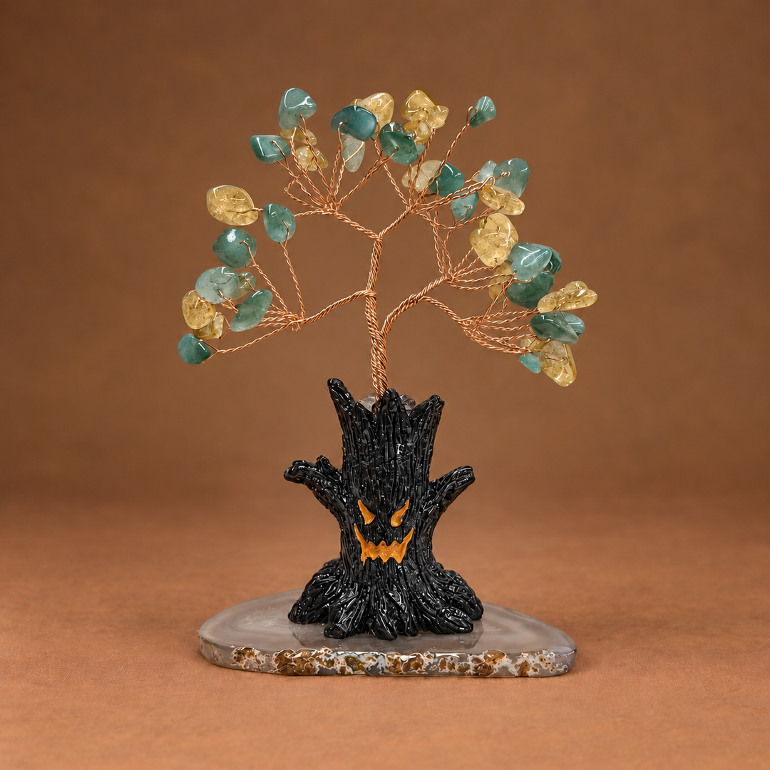 Halloween crystal tree with teal gemstones on copper wire and black bat-shaped base