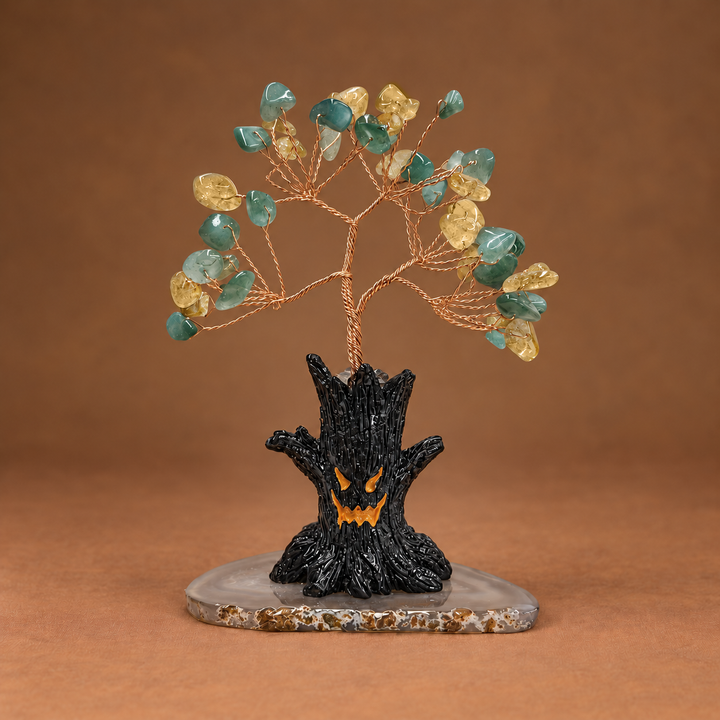 Halloween crystal tree with teal gemstones on copper wire and black bat-shaped base