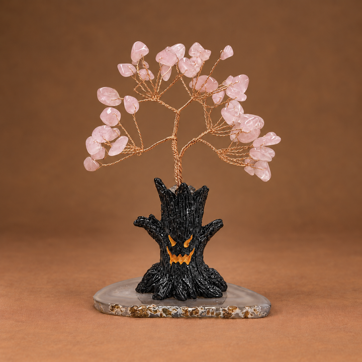 Halloween crystal tree sculpture with pink gemstone branches on black base