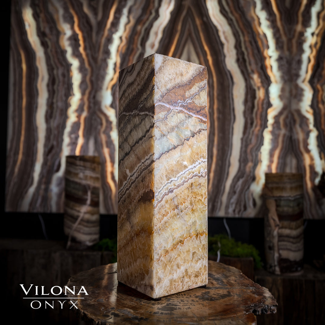Small square table lamp with cream tan onyx stripes on a faceted rectangular stone shade