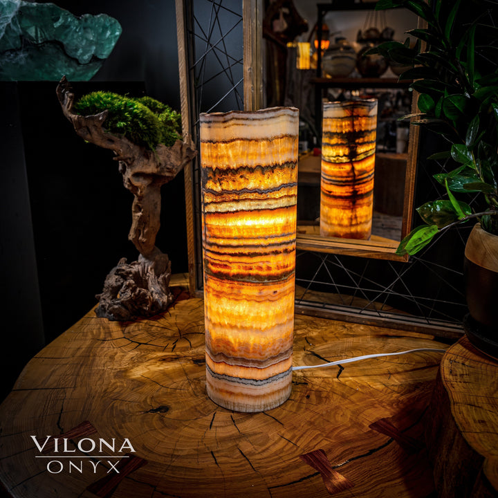 Onyx table lamp with tall cylindrical shade, bright amber stripes with dark edges
