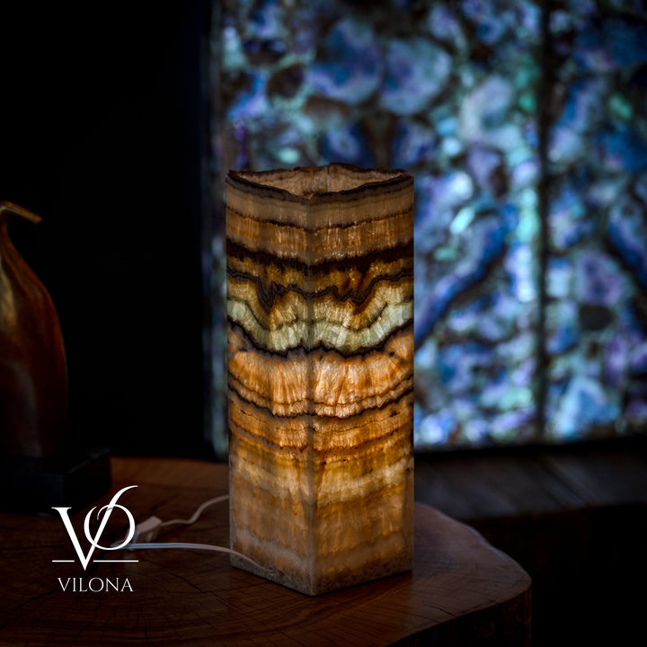 Small table lamp with square live-edge wood body, striped amber and dark brown grain
