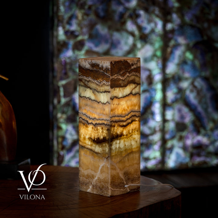 Small onyx table lamp base with glossy square face and multicolor brown-amber striations