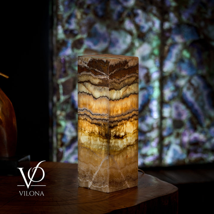 Small onyx table lamp base, square block with amber, cream, and dark brown wavy layers