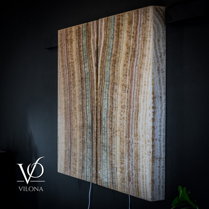 Single onyx-style wall panel with beige and brown vertical lines and muted aqua highlights