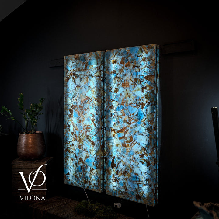 Blue onyx mosaic wall panels with backlit glow, split pair in a stacked design