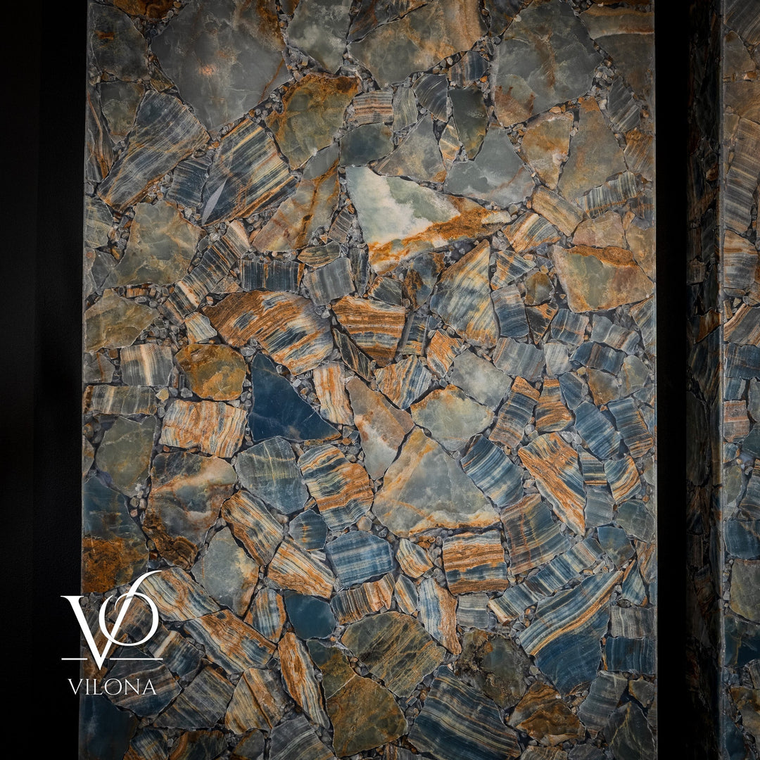 Close-up of backlit stone mosaic pattern in blue-gray and warm amber tones