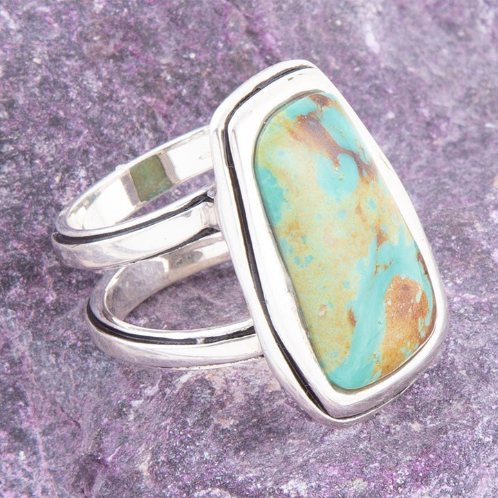 Sterling silver statement ring with turquoise cabochon in raised bezel
