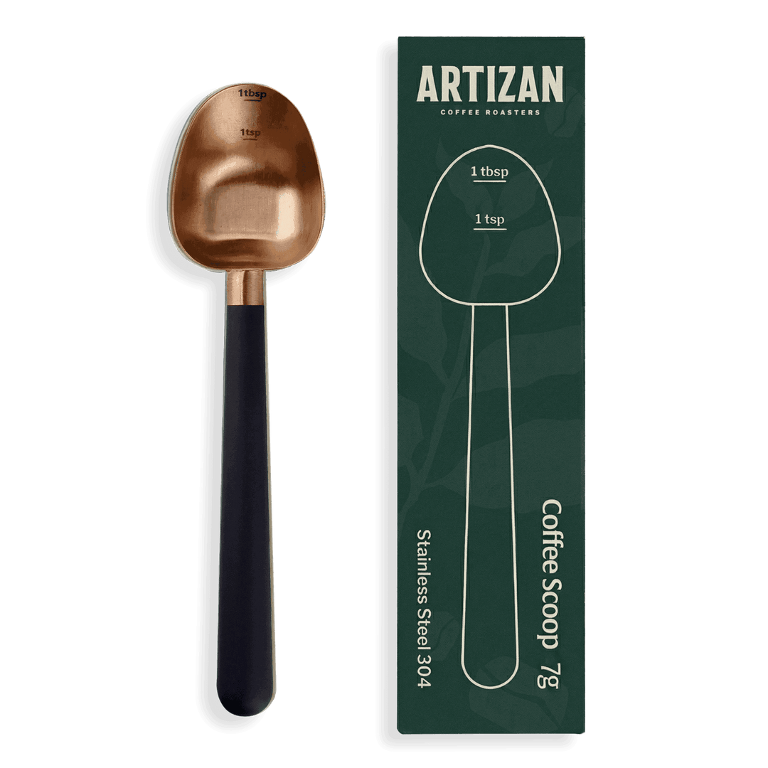 Rose gold coffee measuring scoop with black handle and 1 tbsp/1 tsp markings
