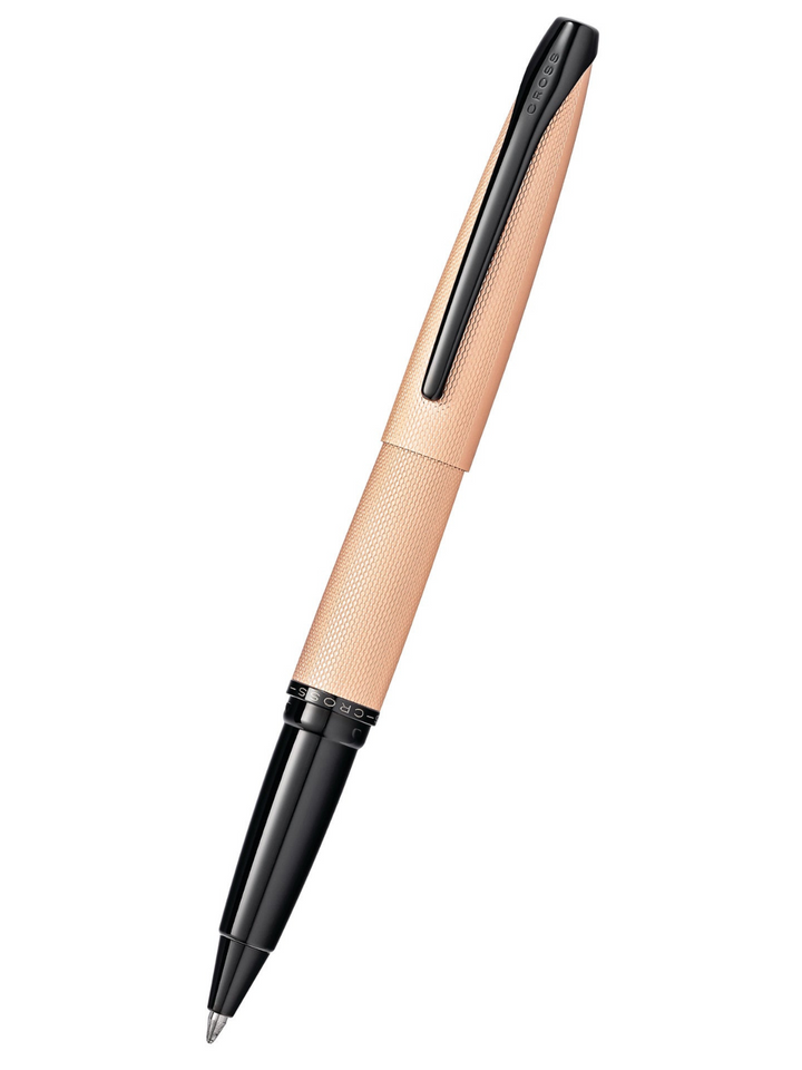 Rose gold rollerball pen with textured barrel and black clip end, angled view