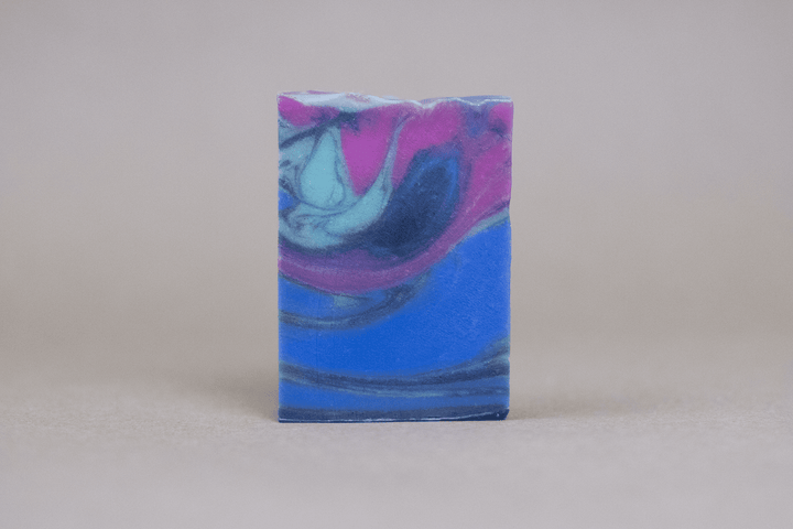 Swirled bar soap in blue, purple, and pink with smooth rectangular shape