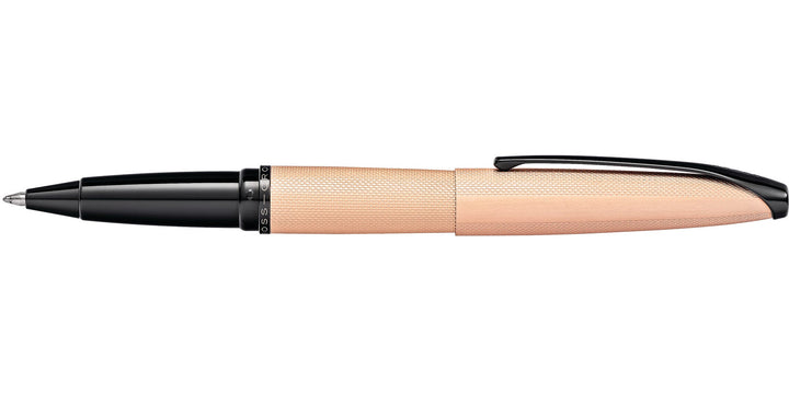 Rose gold rollerball pen with textured barrel and black clicker, side profile