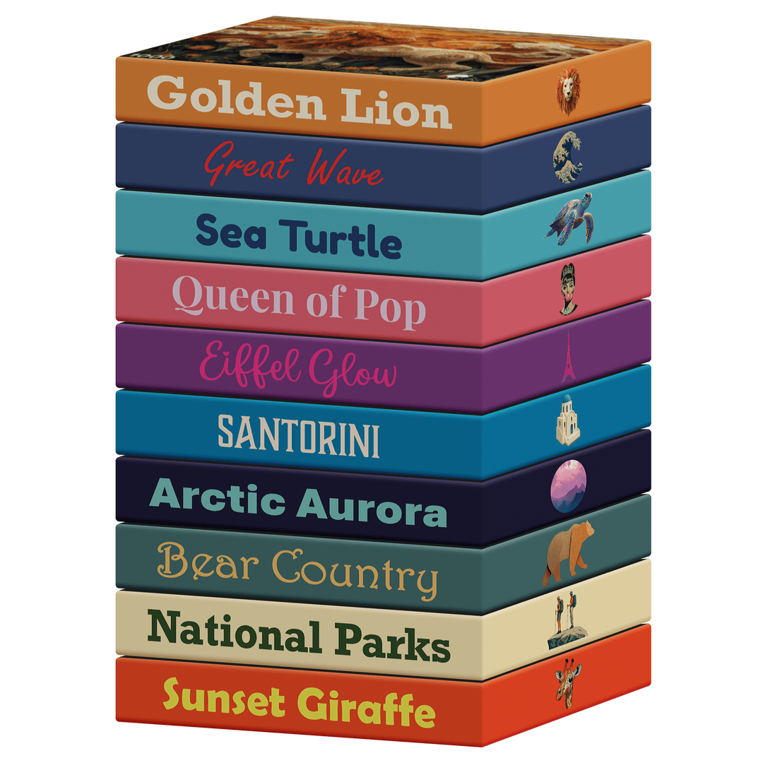 Stack of colorful jigsaw puzzle boxes with printed titles on the sides
