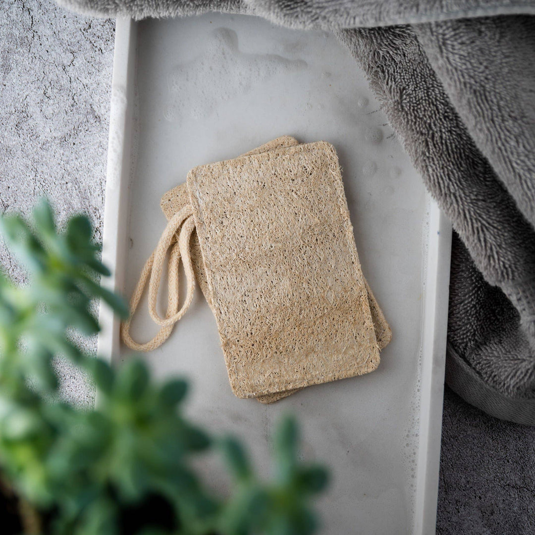 Tan-beige rectangular loofah scrub pads with drawstring loop, set of two