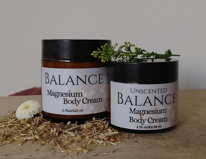 Magnesium body cream jars with BALANCE and UNSCENTED labels, black lids