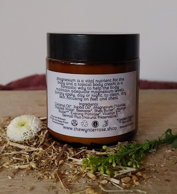 Magnesium body cream jar showing back label with ingredient and use details, black lid