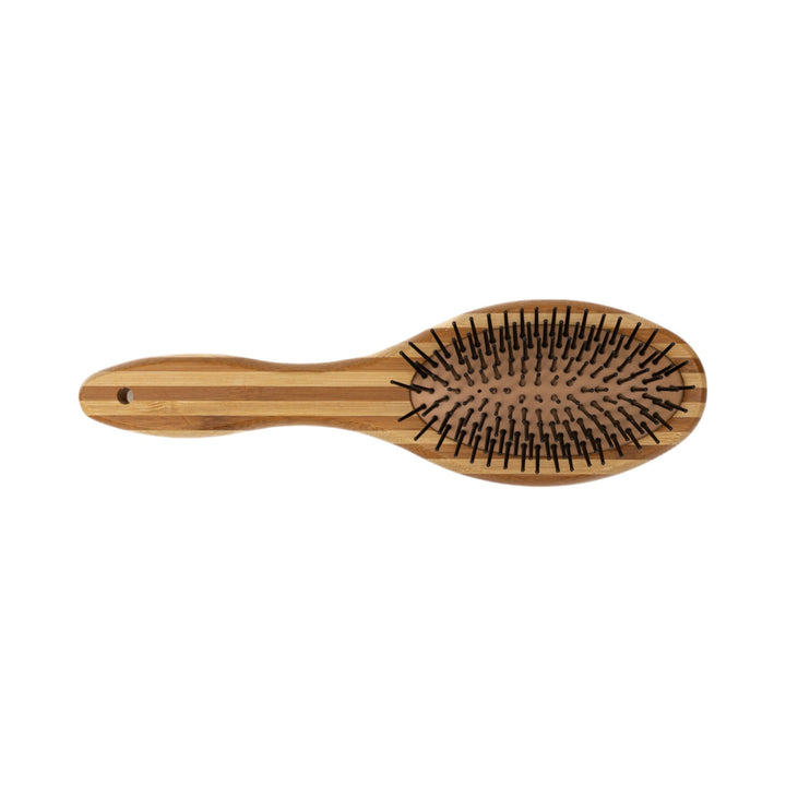 Natural wood dog grooming brush with oval pin side and ergonomic handle