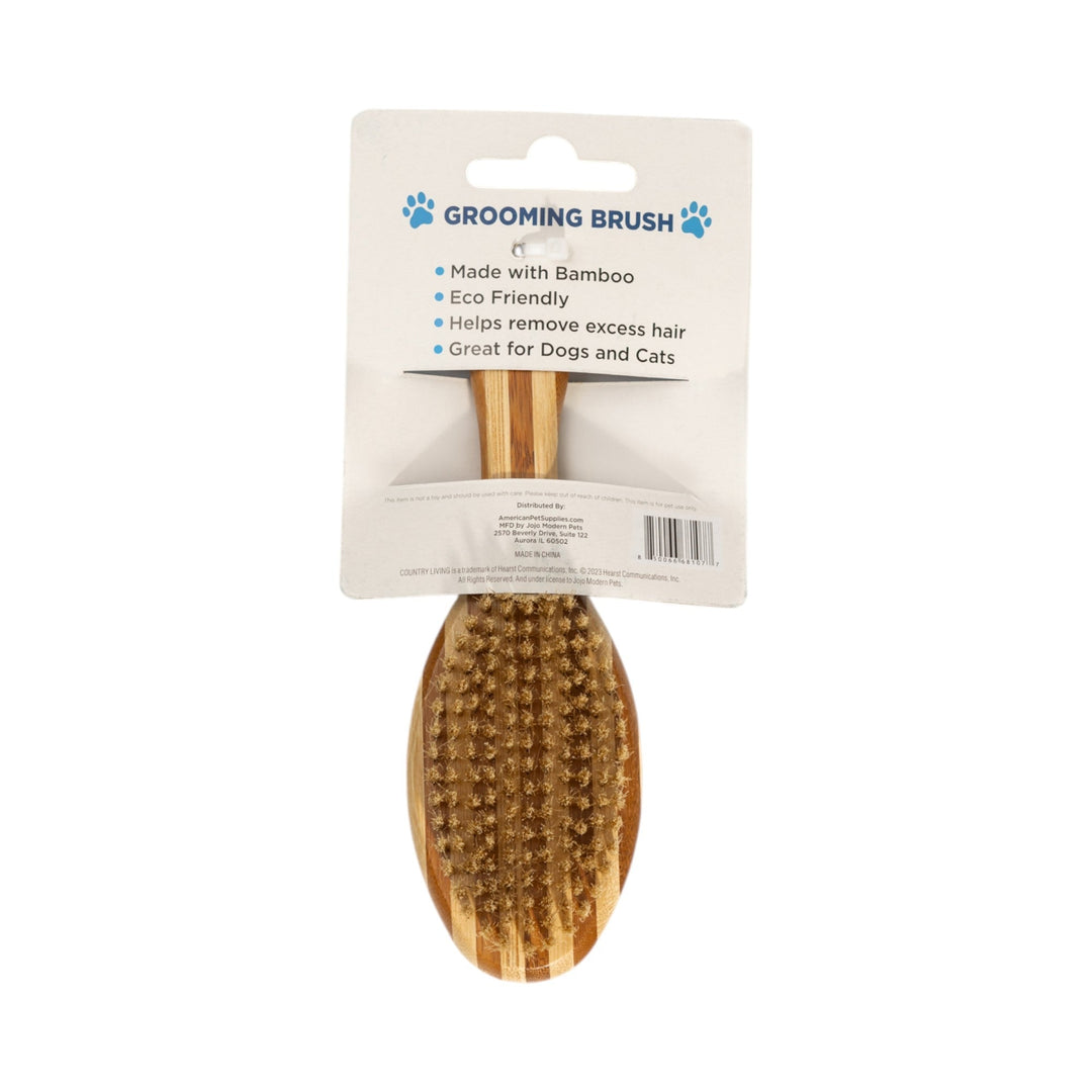 Natural wood grooming brush in retail pack with oval bristle head and handle