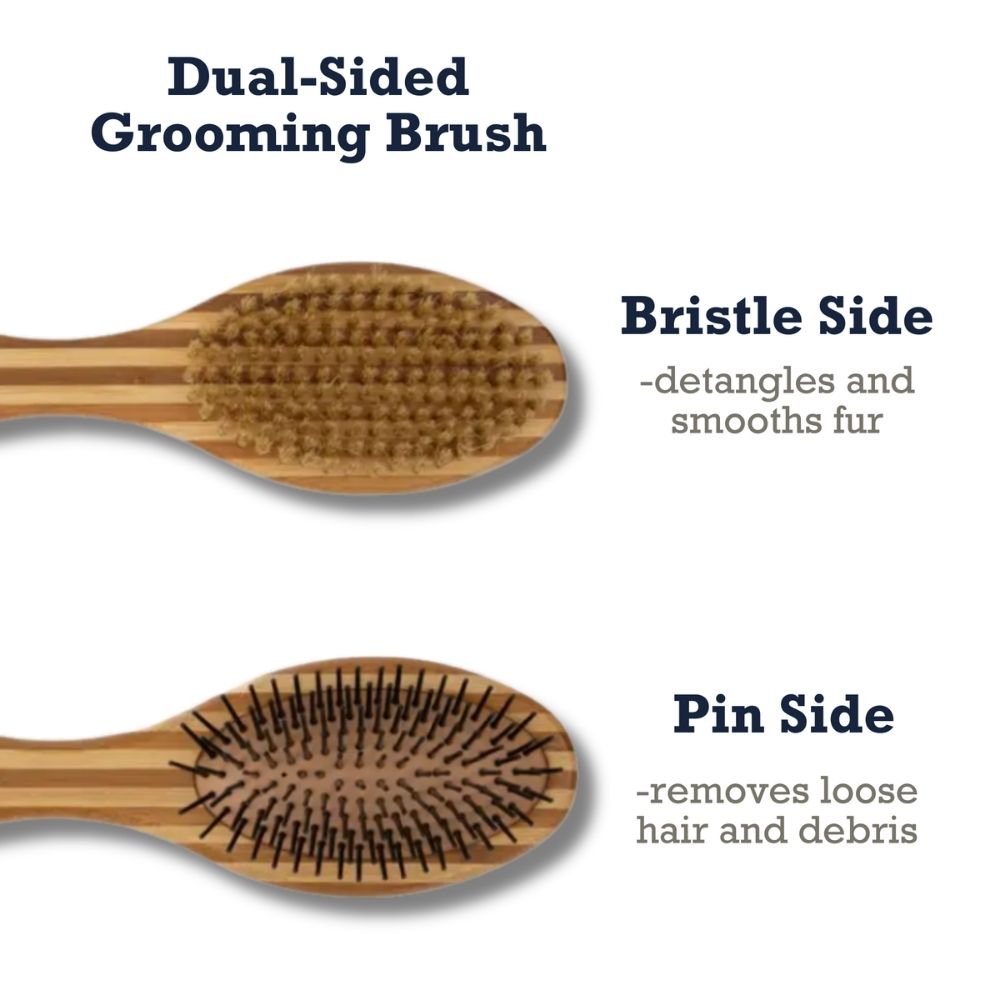Dual-sided dog grooming brush with bristle side and pin side on a wood paddle