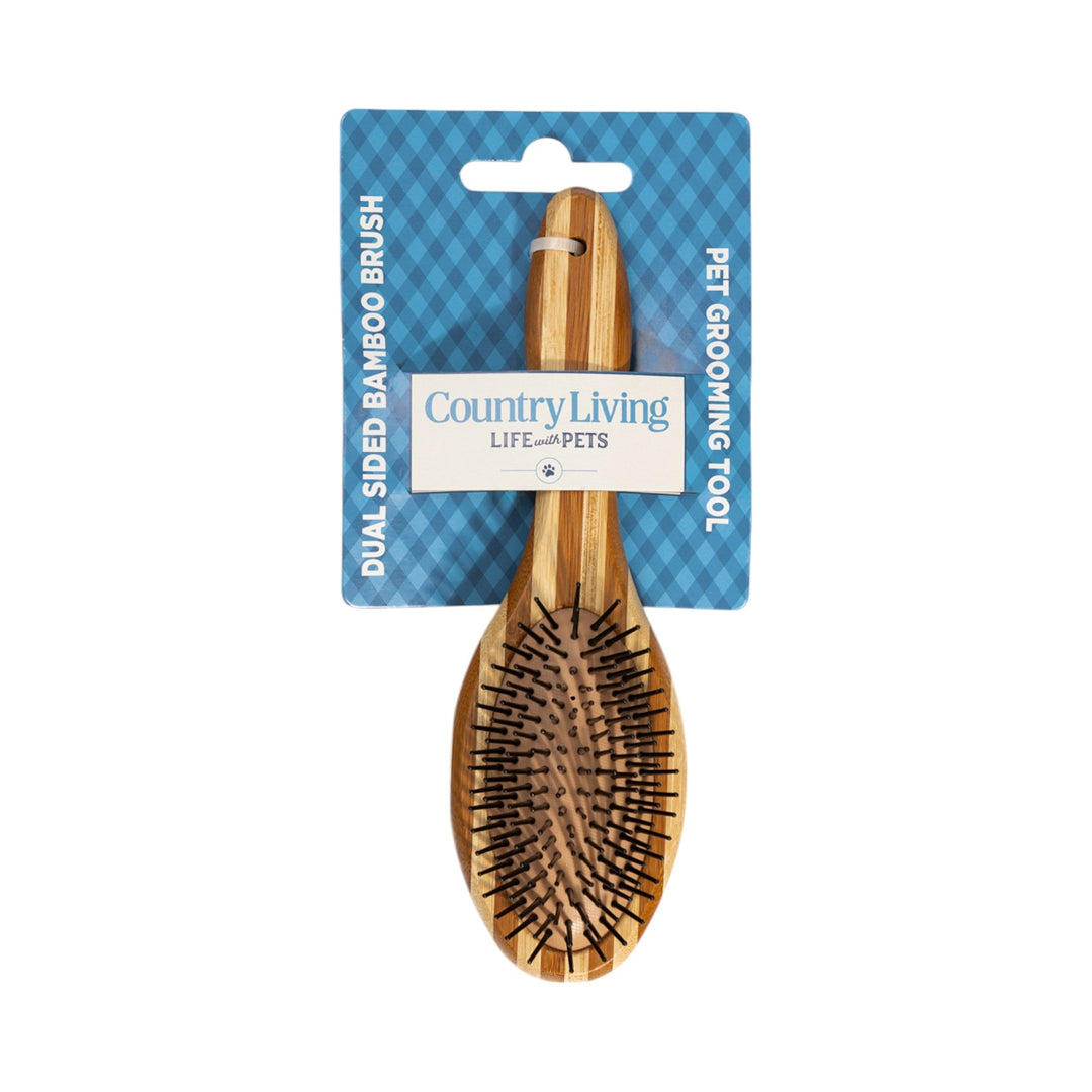 Natural wood dual-sided dog grooming brush with oval paddle head and two brush surfaces