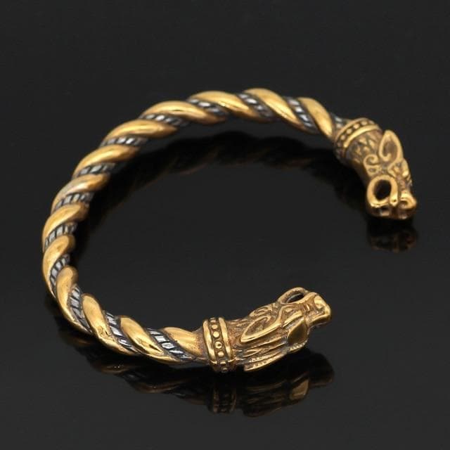 Close-up of braided bracelet with ornate wolf-head end cap