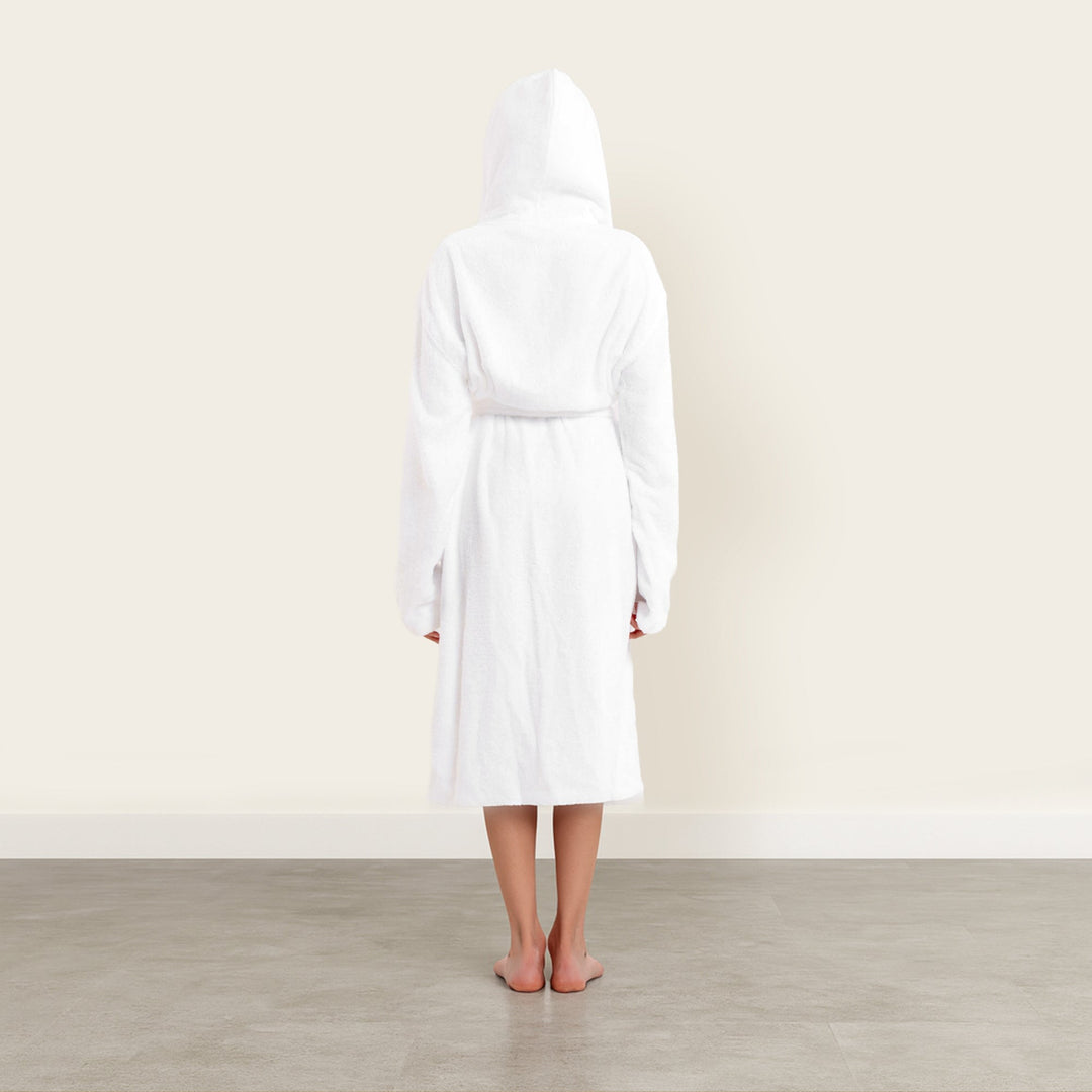 White unisex hooded bathrobe, full length with tie belt; back view with robe hanging.