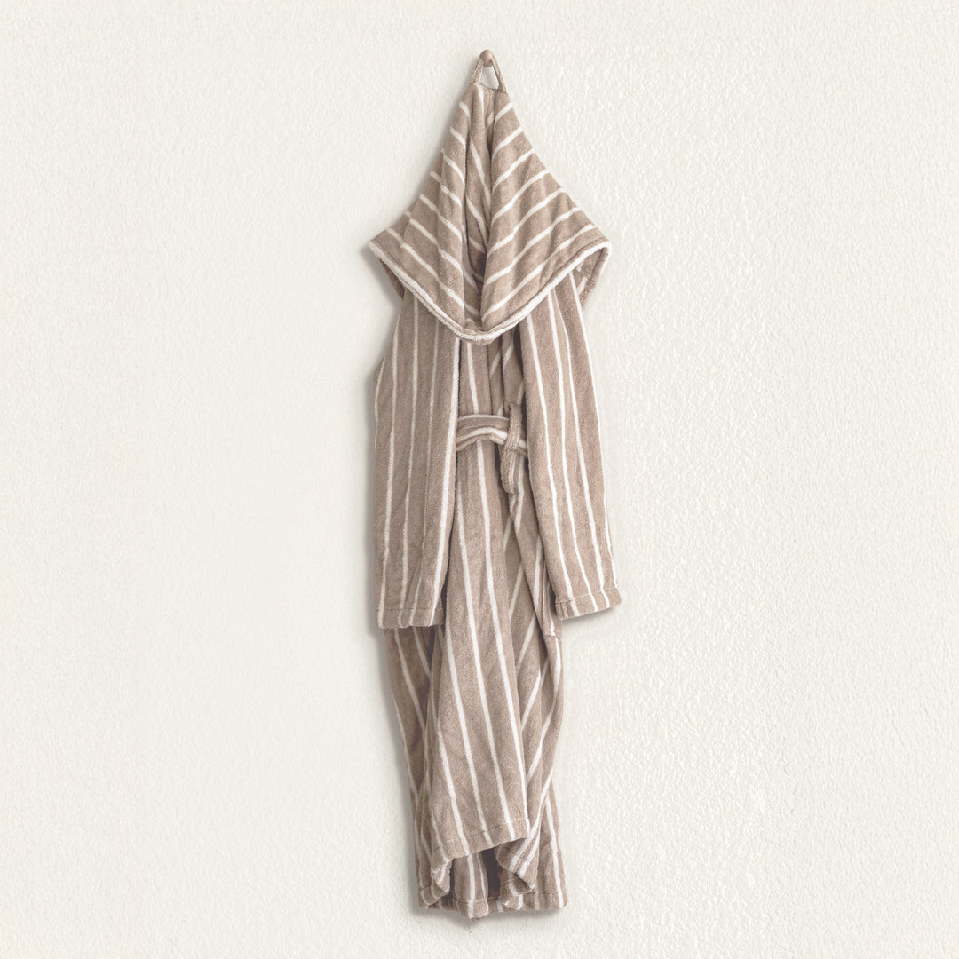Striped unisex hooded bathrobe laid flat, tied belt and full sleeves visible