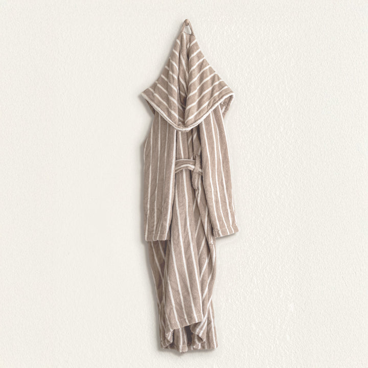 Striped unisex hooded bathrobe laid flat, tied belt and full sleeves visible