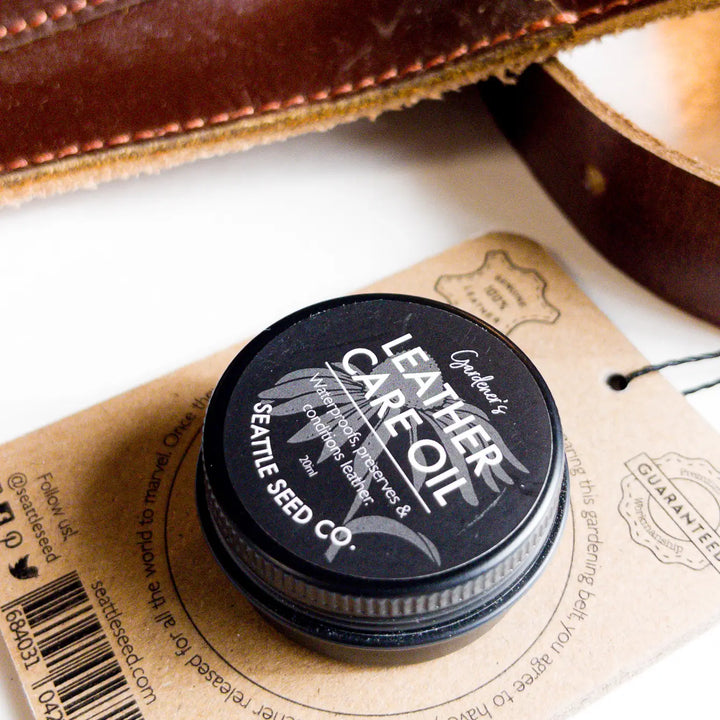 Leather care balm tin with branded label and matching warranty card