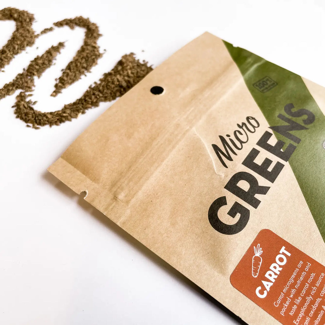 Carrot microgreen seed packet, kraft paper pouch with green label and carrot icon