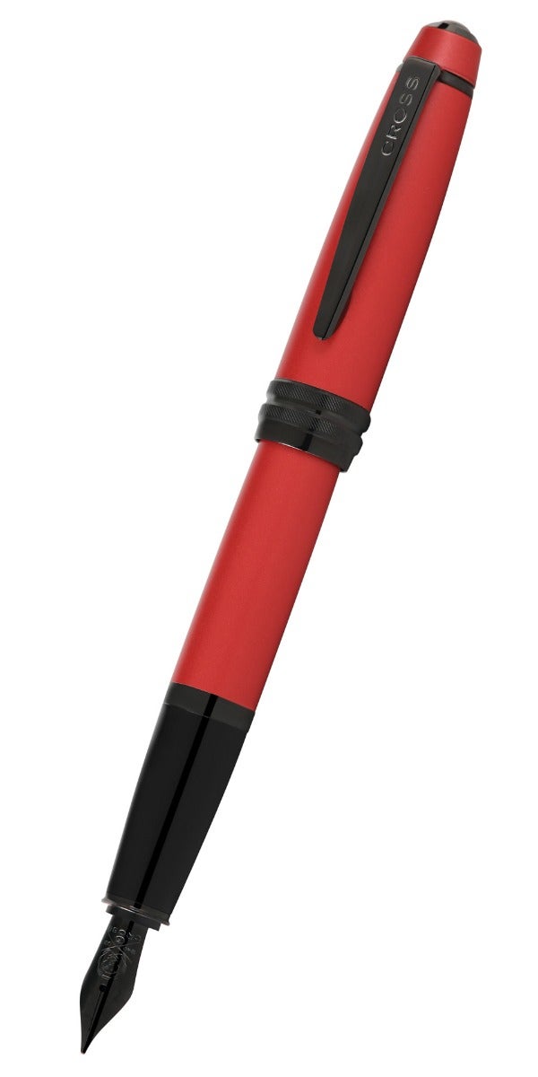 Red matte lacquer fountain pen angled view with black nib and grip band