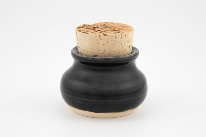 Mini corked jar with black glazed body and cork stopper