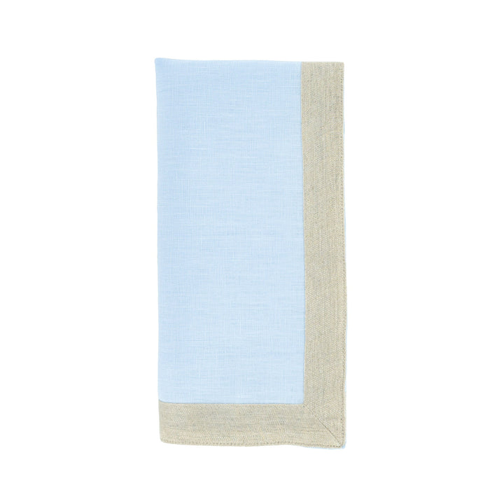 Light blue linen napkin with beige border trim, vertical fold