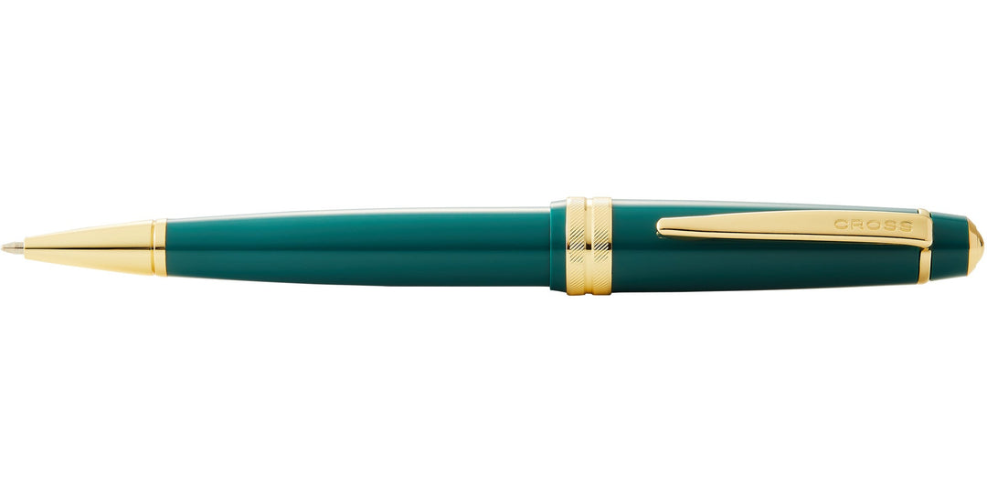 Green resin ballpoint pen profile view with gold-tone accents and tip