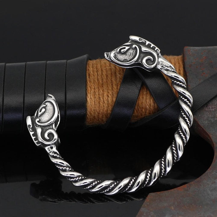 Stainless steel bracelet with engraved dragon head tips and twisted rope links