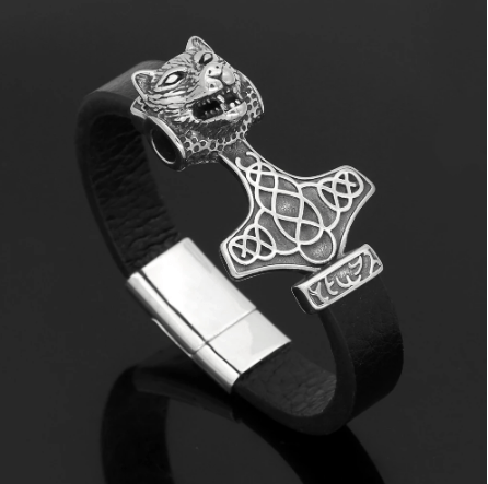 Leather bracelet with wolf-head charm and engraved Mjolnir hammer pendant