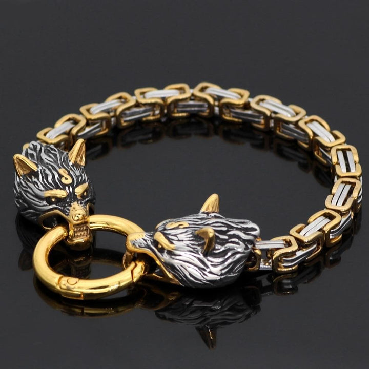 Wolf head bracelet charm links with gold ring clasp on a dark two-tone chain