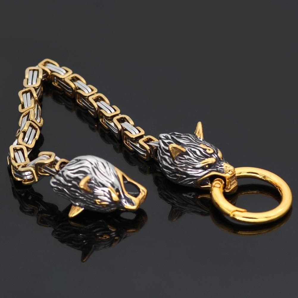 Stainless steel bracelet with two wolf head charms and gold ring lobster clasp