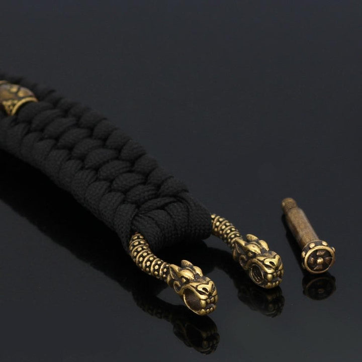 Black paracord bracelet with gold-toned clasp ends and small hammer charm