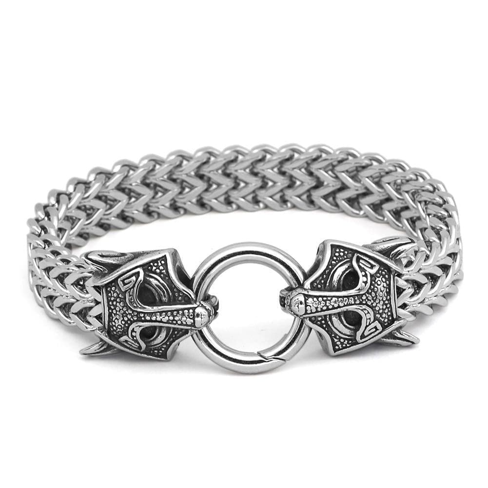 Stainless steel chain bracelet with circular clasp and wolf-head charms, silver-tone