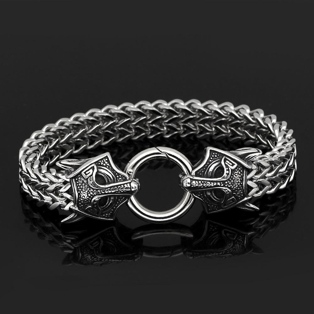 Silver-tone chain bracelet with circular clasp ring and twin wolf-head charms