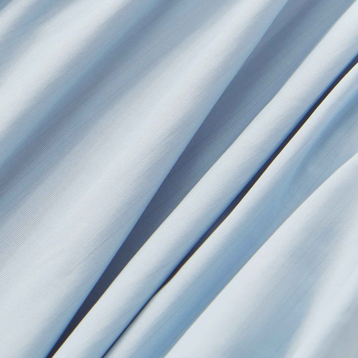 Light blue cooling fabric with smooth texture and subtle striped weave