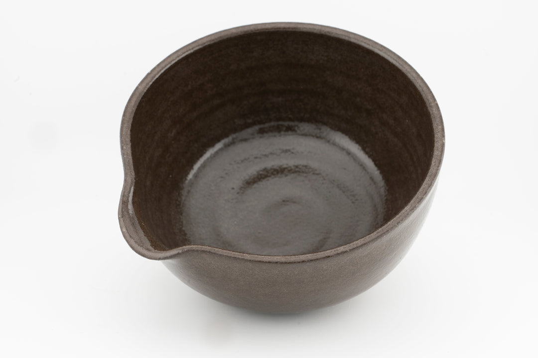 Interior view of a brown matcha bowl with smooth base