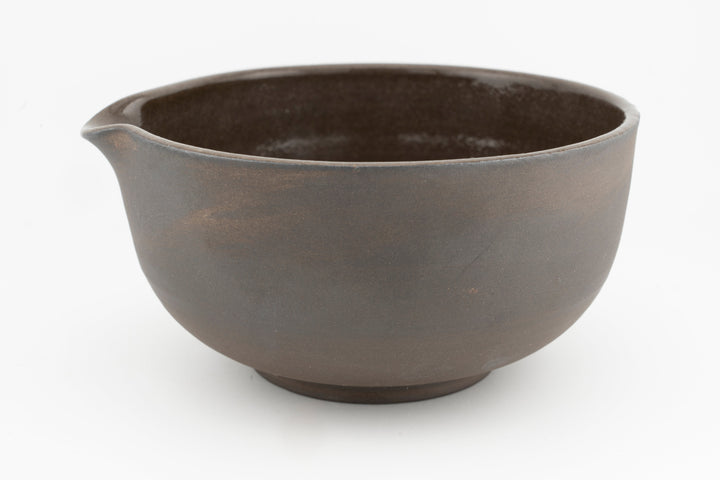 Brown stoneware bowl with wide rim, smooth interior finish
