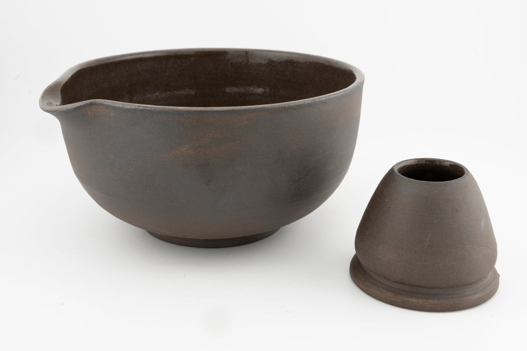Brown stoneware matcha bowl with matching conical whisk holder